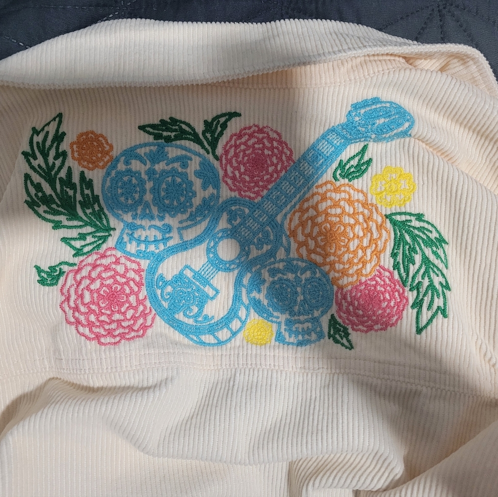 Disney Cream Top with Colorful Floral and Guitar Design